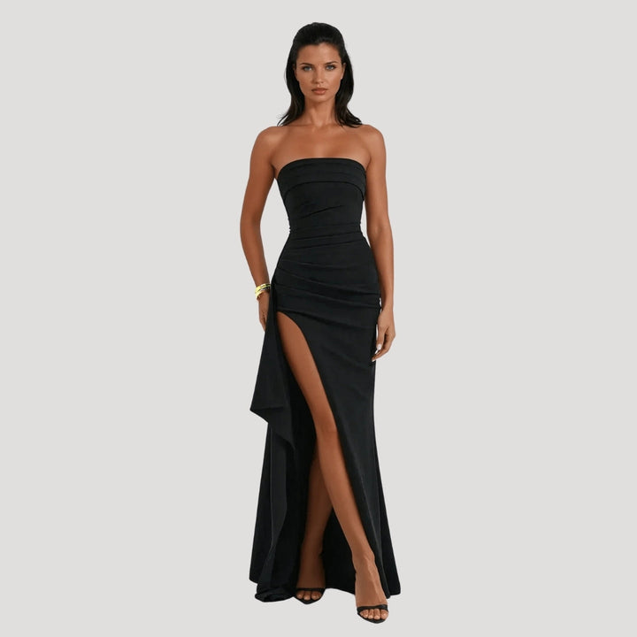 Model posing front angle long gown plain background minimal studio