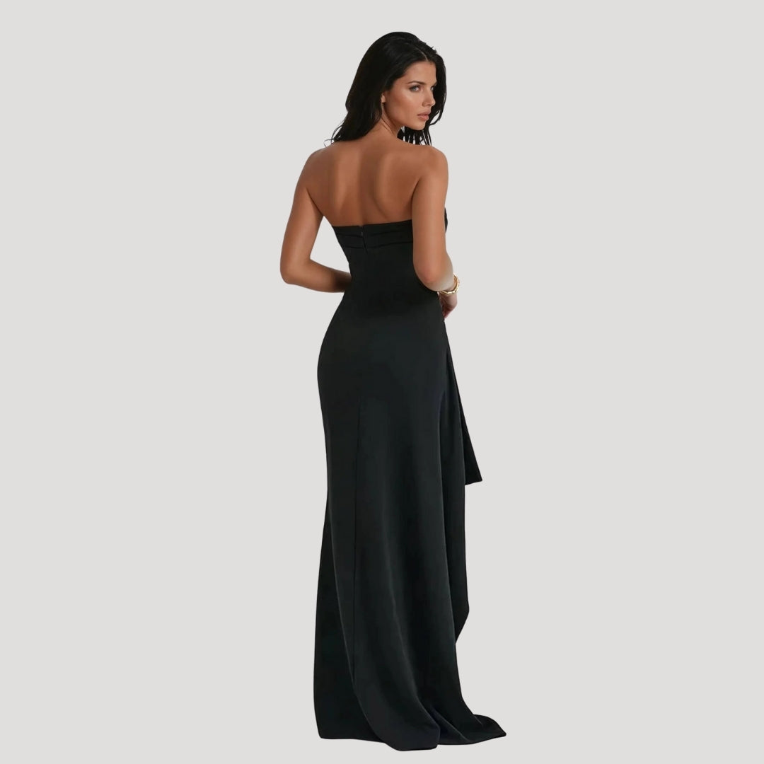 Model back view showcasing long dress plain background clean studio