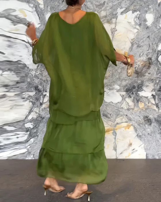 Neutral background image of green  layered dress