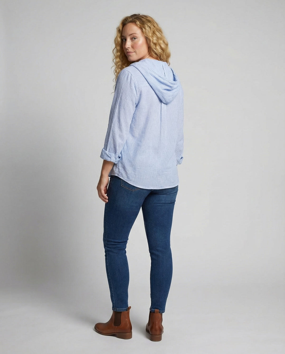 Female model in a lightweight blouse styled for everyday wear.
