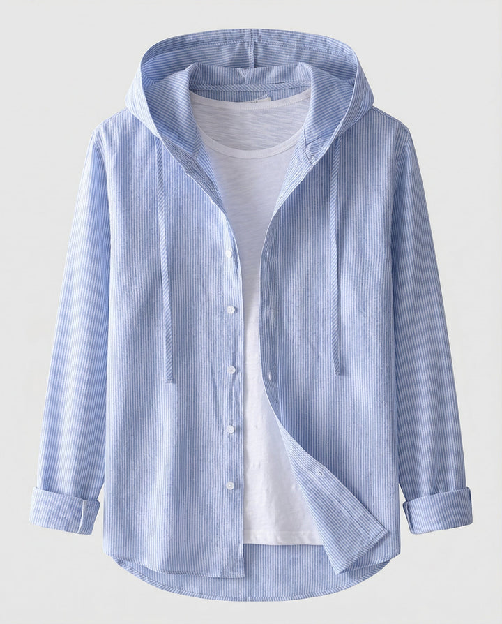 Woman wearing a classic blouse with a relaxed fit against a plain backdrop.
