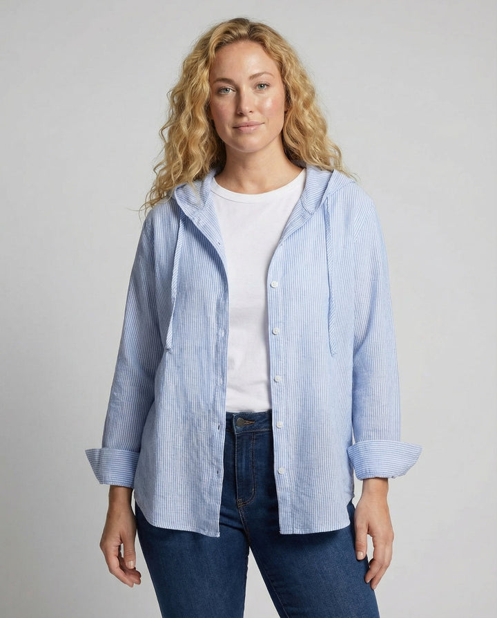 Female model wearing a lightweight blouse with a classic design against a plain background.
