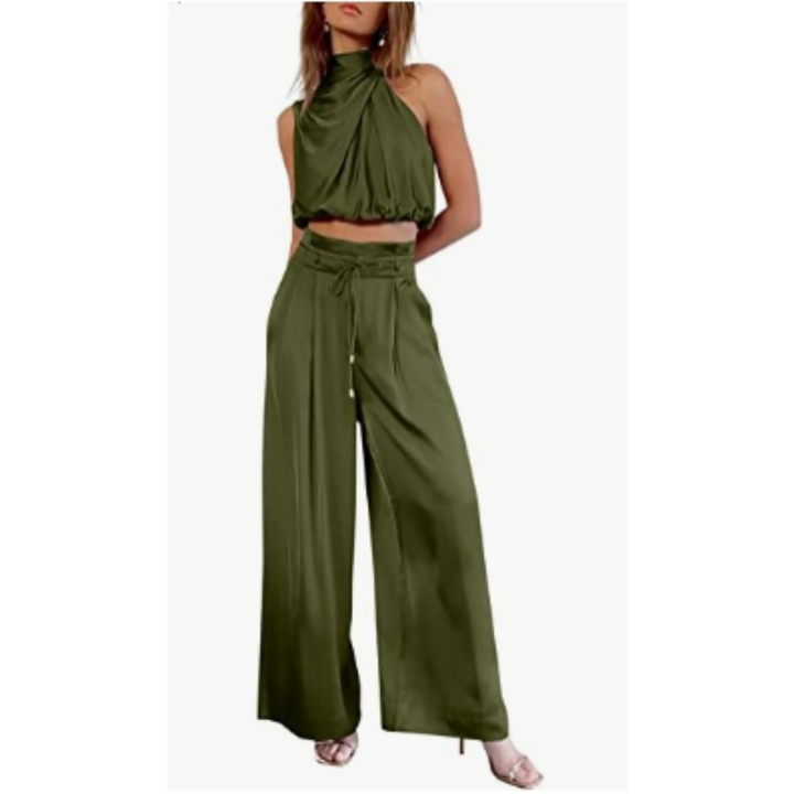Female in a modern two-piece ensemble featuring a halter-style design on a plain background.