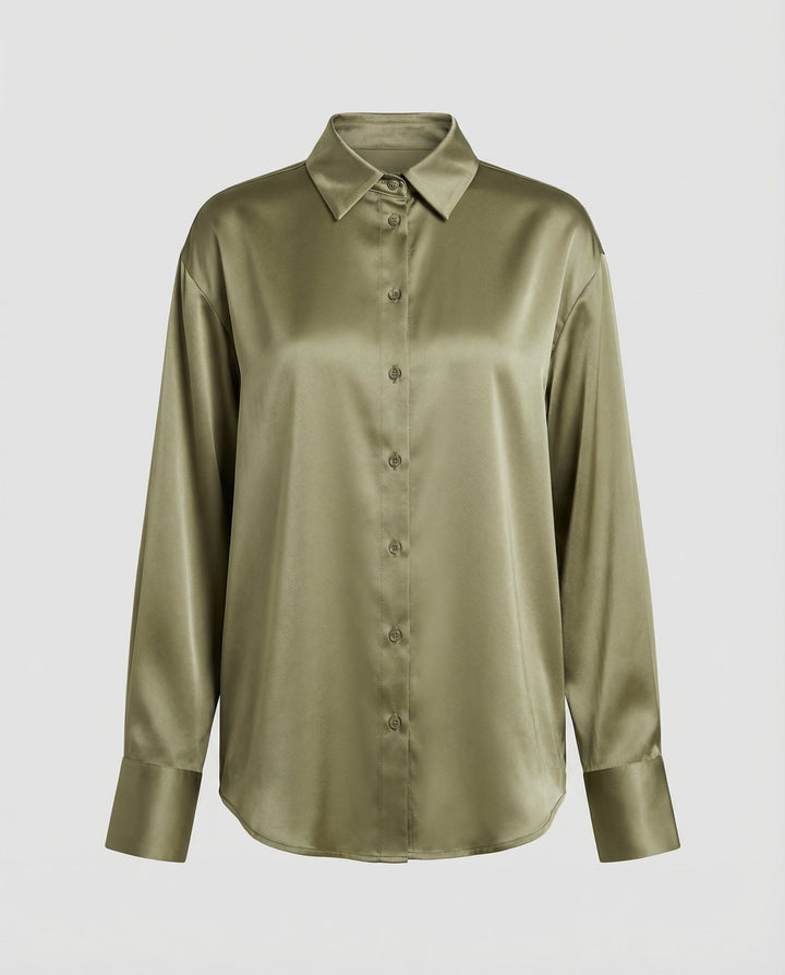 Female model wearing a classic silk blouse suitable for office and evening wear.