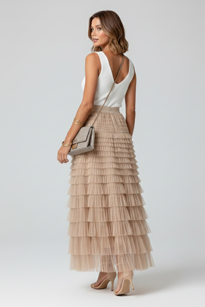 Model back view wearing layered sheer skirt