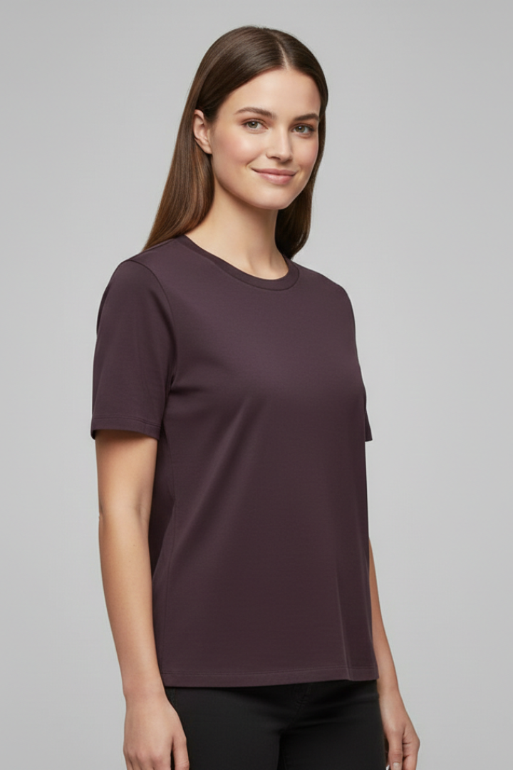 Model wearing everyday top displayed against plain backdrop