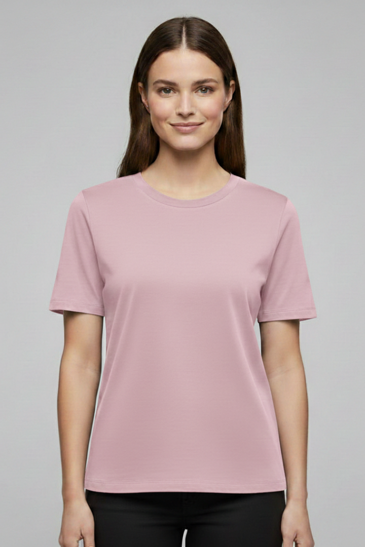Front pose of female model wearing a basic pink shirt