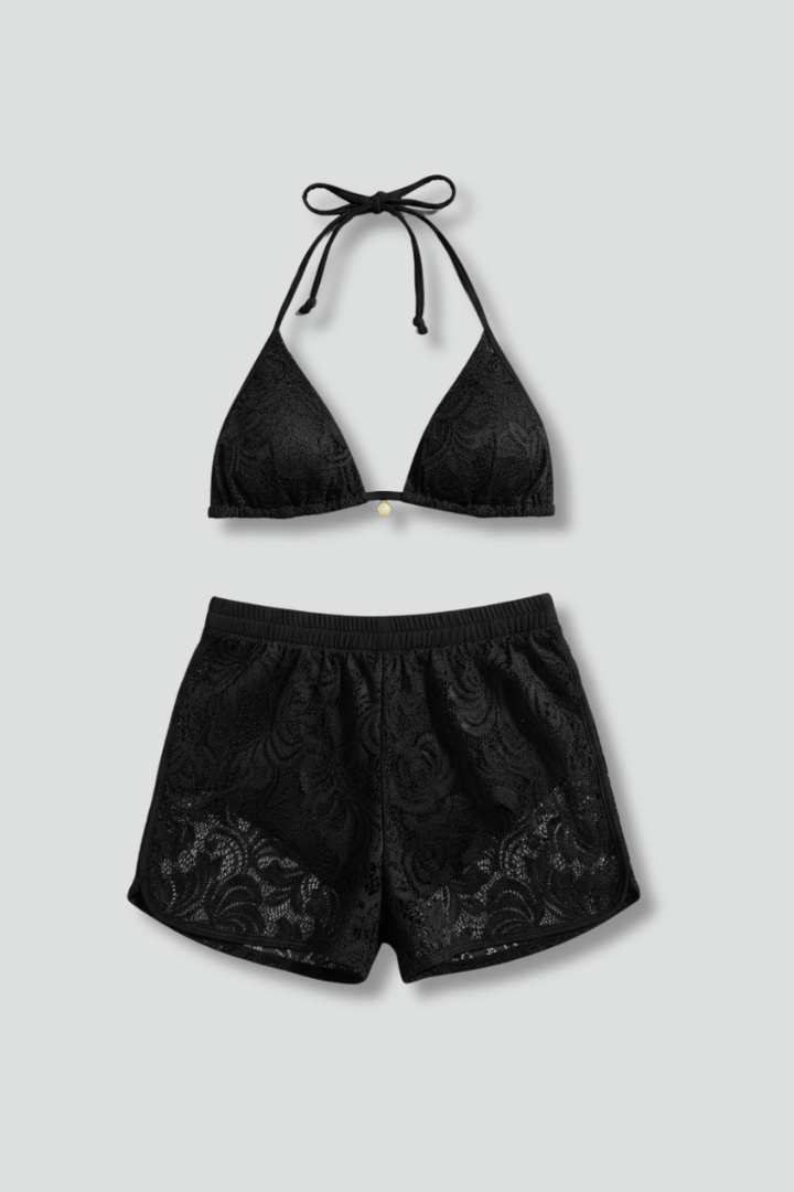 Showcasing two piece black top and lace textured swim shorts 