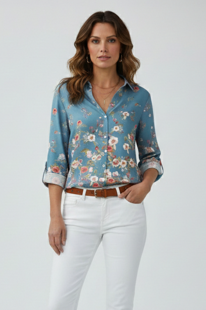 Model wearing light blue sheer blouse with button closure