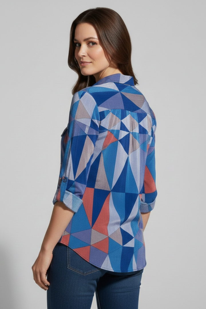 Blue patterned collared blouse with rolled sleeves back pose