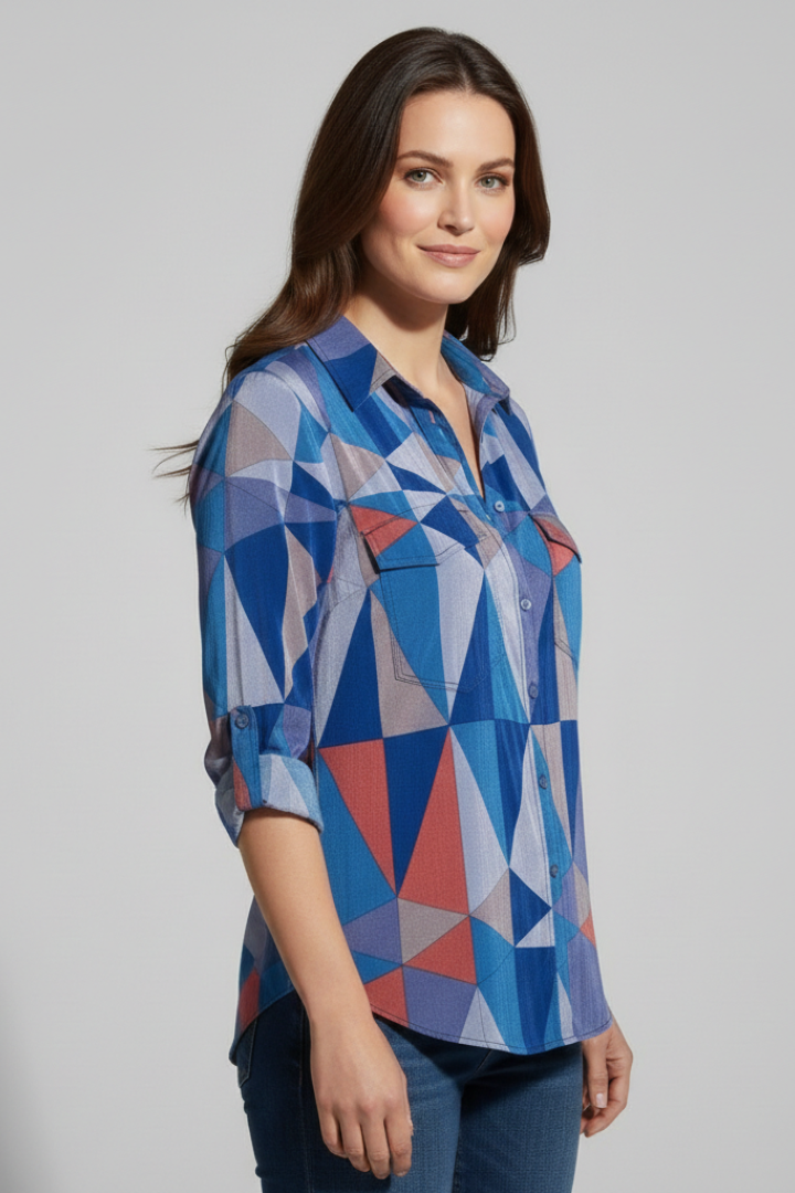 Model wearing abstract print button shirt side pose