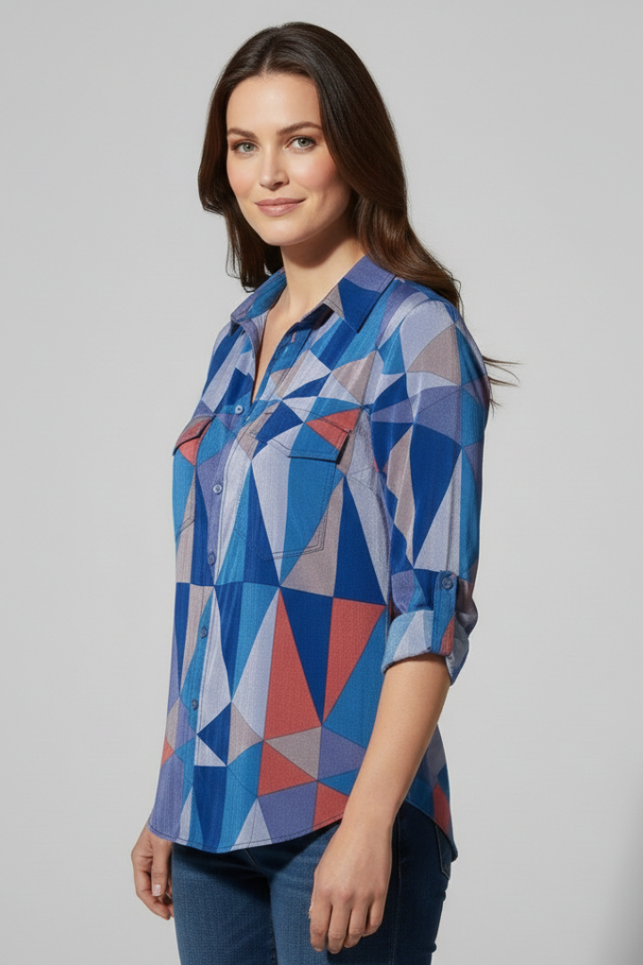 Model in abstract triangle print blouse worn with jeans