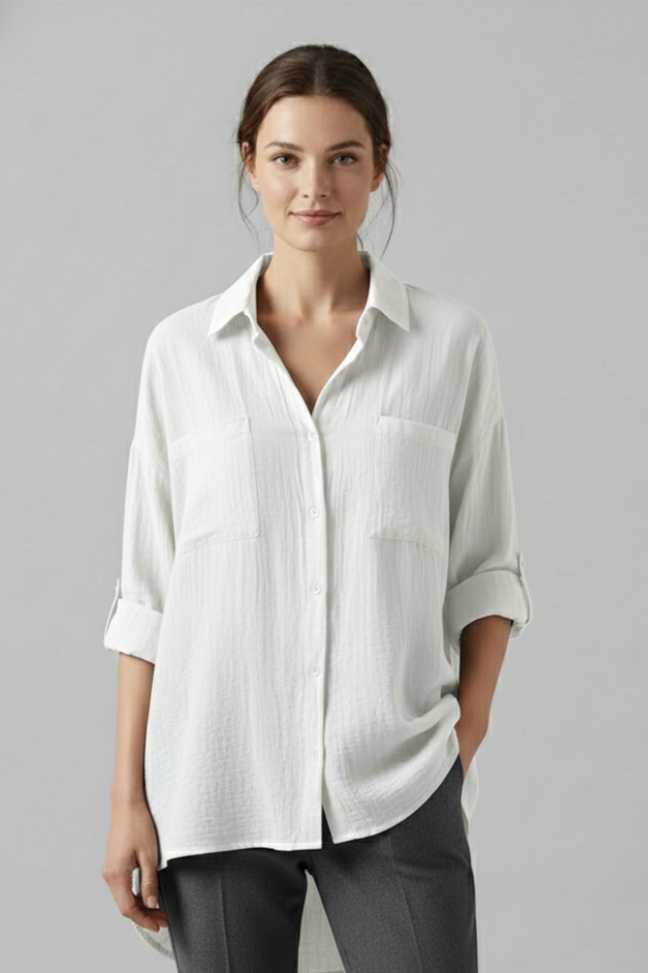 Front angle view of a model wearing casual collared white blouse