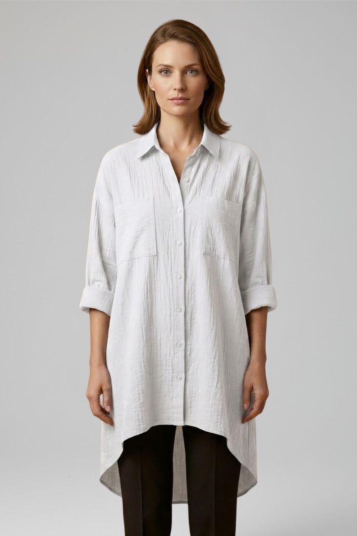Timeless woven white blouse with collar in studio view