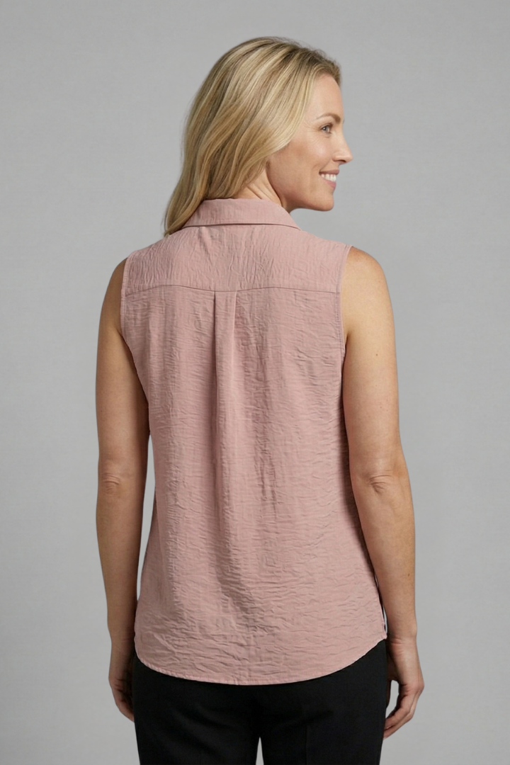 Relaxed fit blush blouse shown on female model back angle