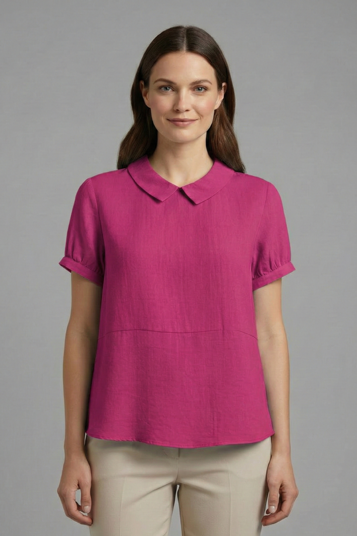 Model in collared pink blouse front fromal view