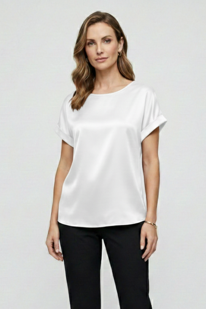 Polished white blouse with soft shine studio shot