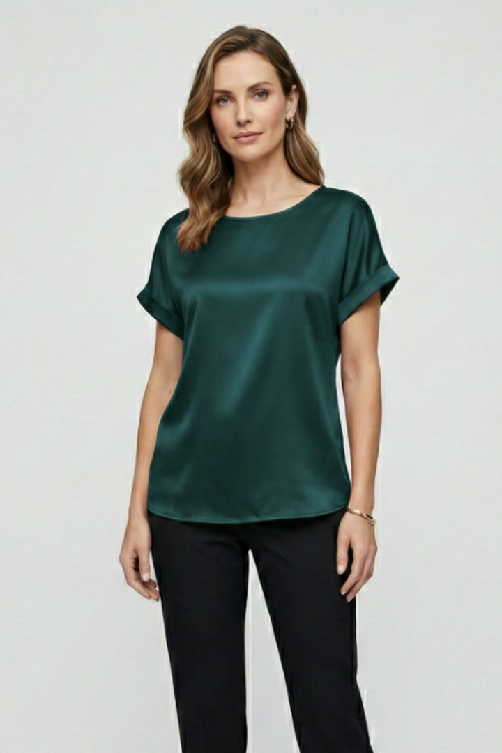 Front angle of silky green top with drape