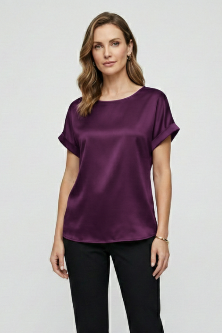 Chic satin women's blouse against plain gray background