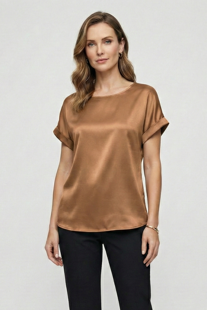 Minimalist studio image of silky brown fashion top