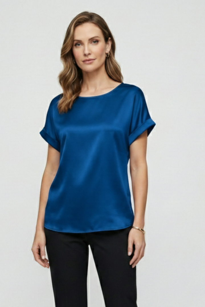 Loose silky blue top on model white background