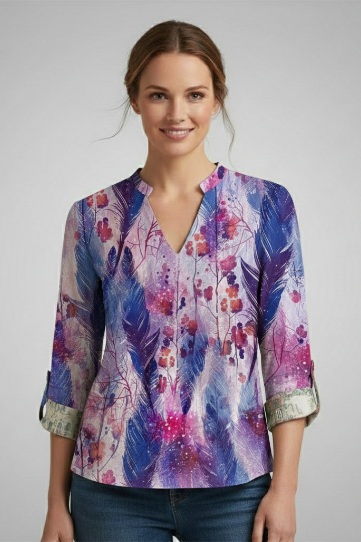 Studio portrait featuring artistic print blouse and denim