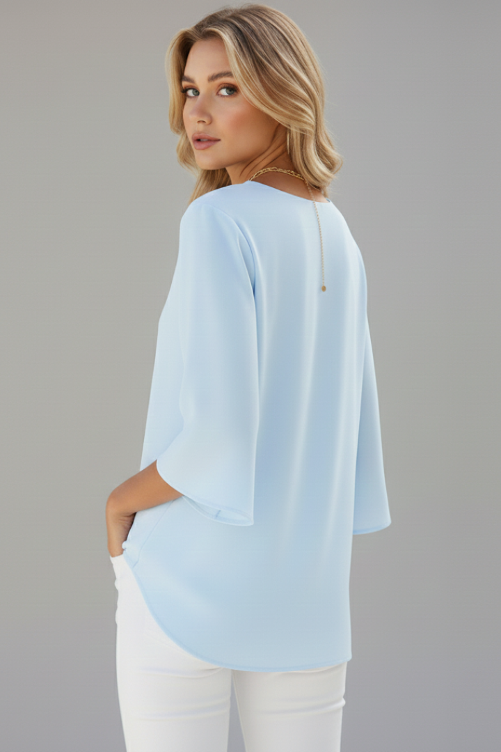 Stylish workwear top back look studio grey backdrop