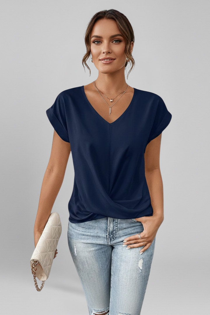 Front close-up of blue blouse neckline and sleeve detail