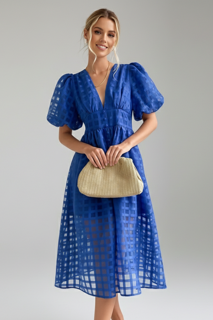 Elegant lace blue skirt detail on model 