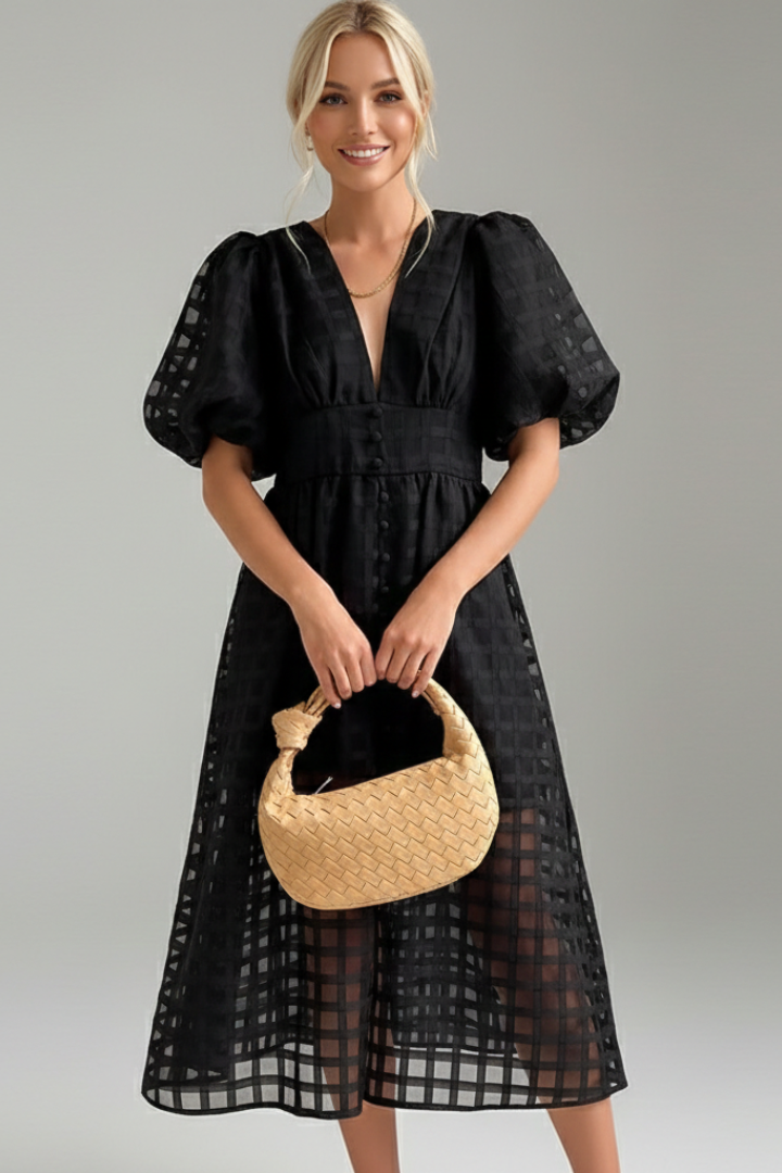 Model with woven bag in close view wearing a V-neck lace dress