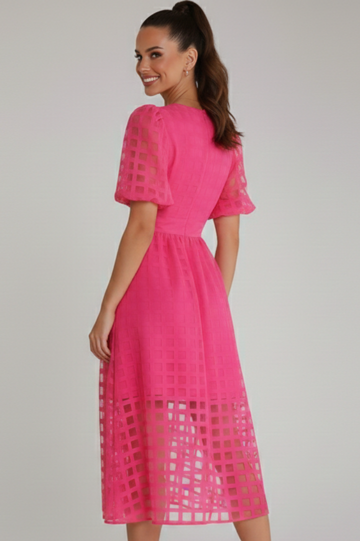 Back view of lace pink dress on female smiling model