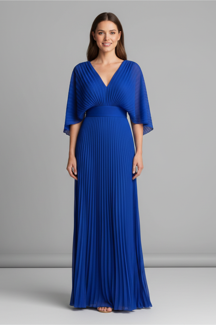 Model wearing pleated blue maxi dress on gray background