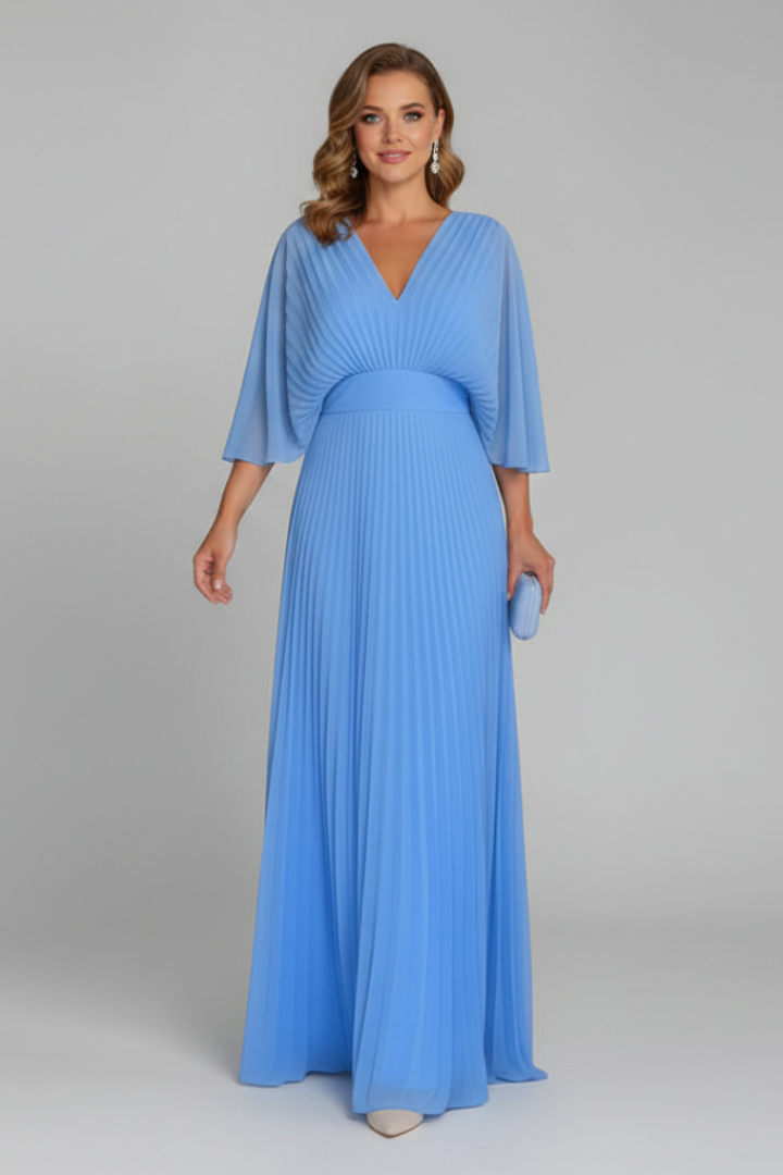 Female model styled in a high-rise skirt with a minimal finish on a plain background.
