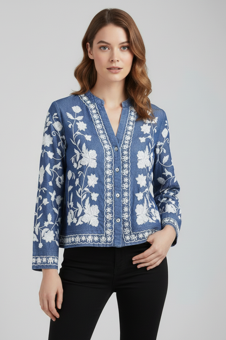 Floral detail blouse displayed neatly on gray background