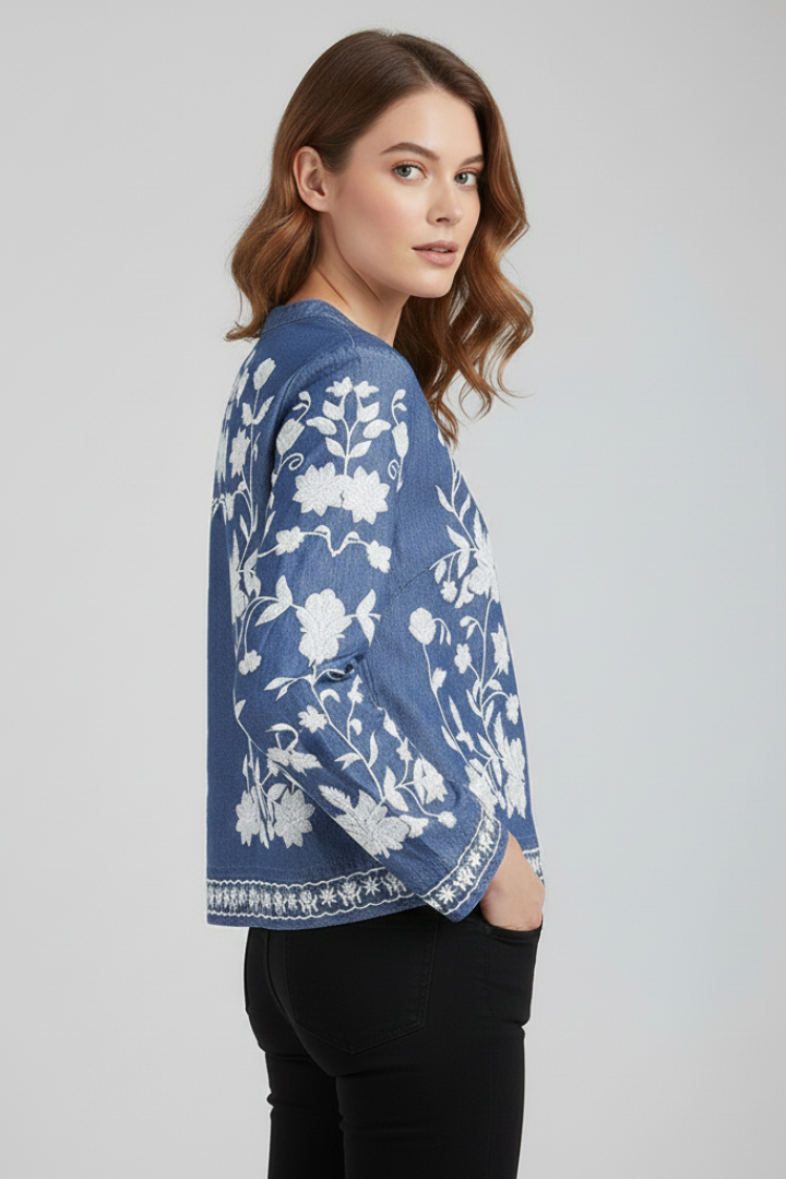 Side embroidered women’s blouse in gray background