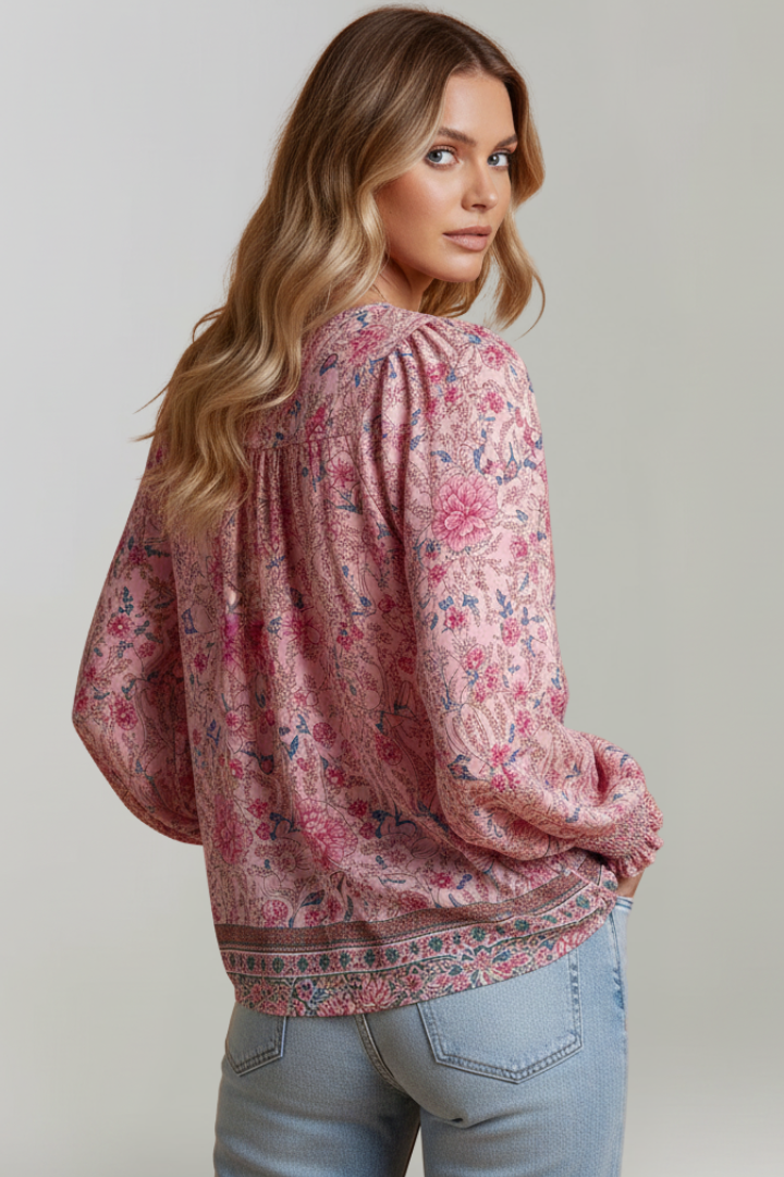 Back view Long sleeve floral top paired with jeans