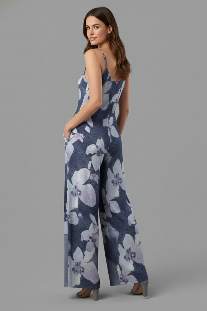 Woman posing in a two-piece lounge outfit with ruched waist detail and full-length pants on a plain background.