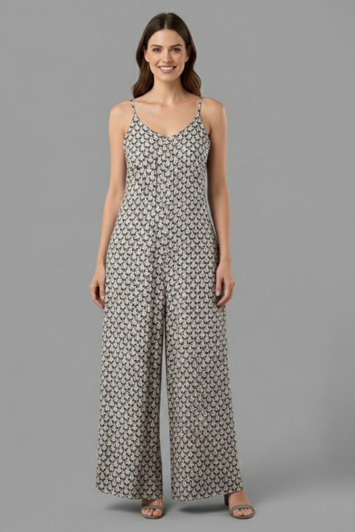 Female model showcasing a flowing wide-leg pants on a plain backdrop