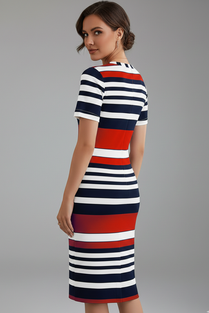 Female model showing knee-length striped dress with short sleeves, gray background.