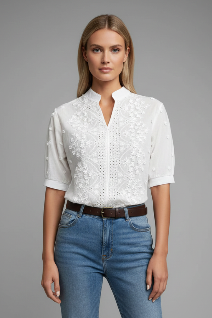 Front view white embroidered blouse on gray background