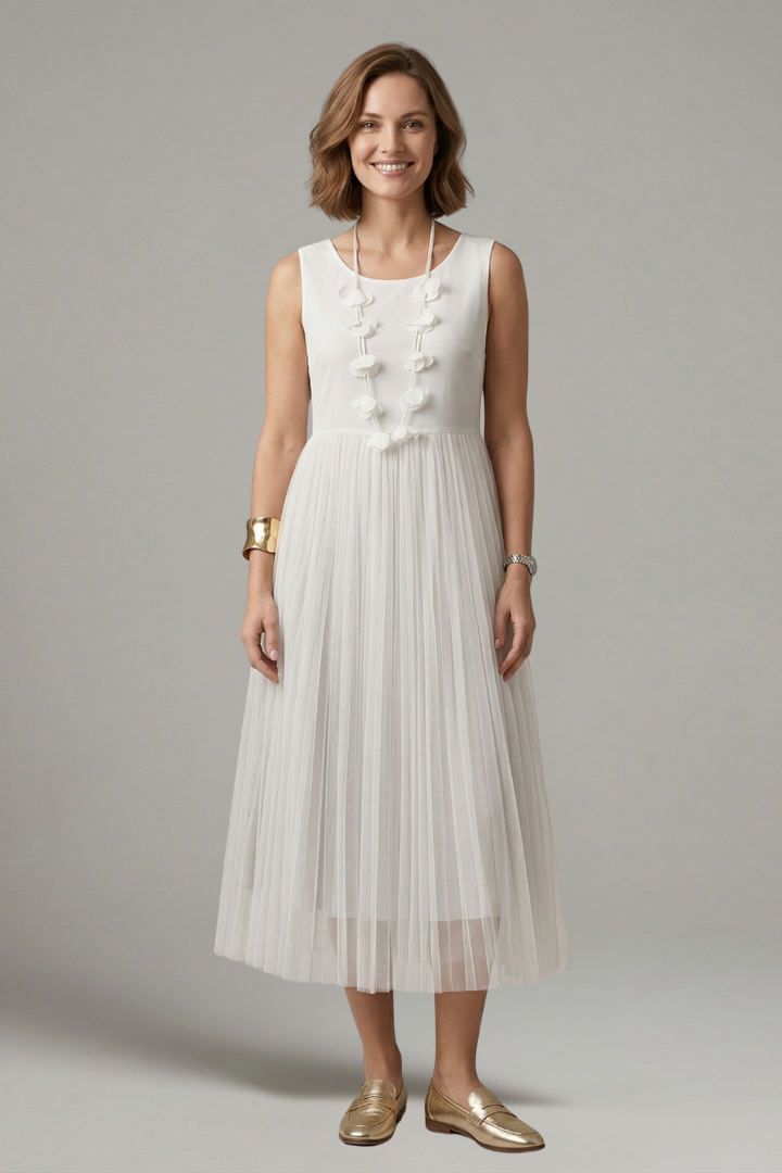Classic pleated women’s white dress gray background image