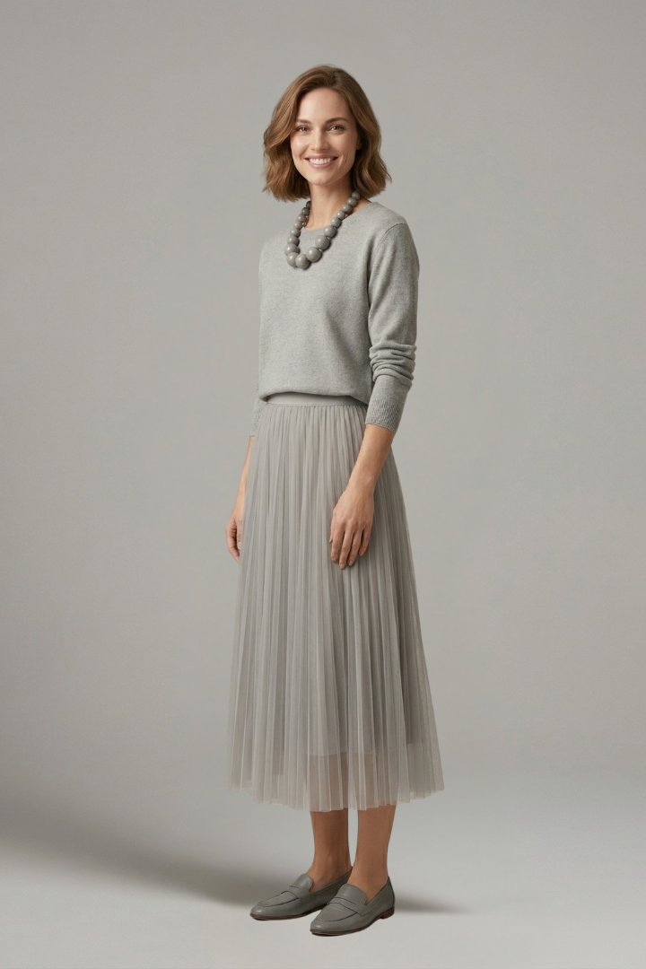 Woman in full shot round neck long sleeve dress gray background
