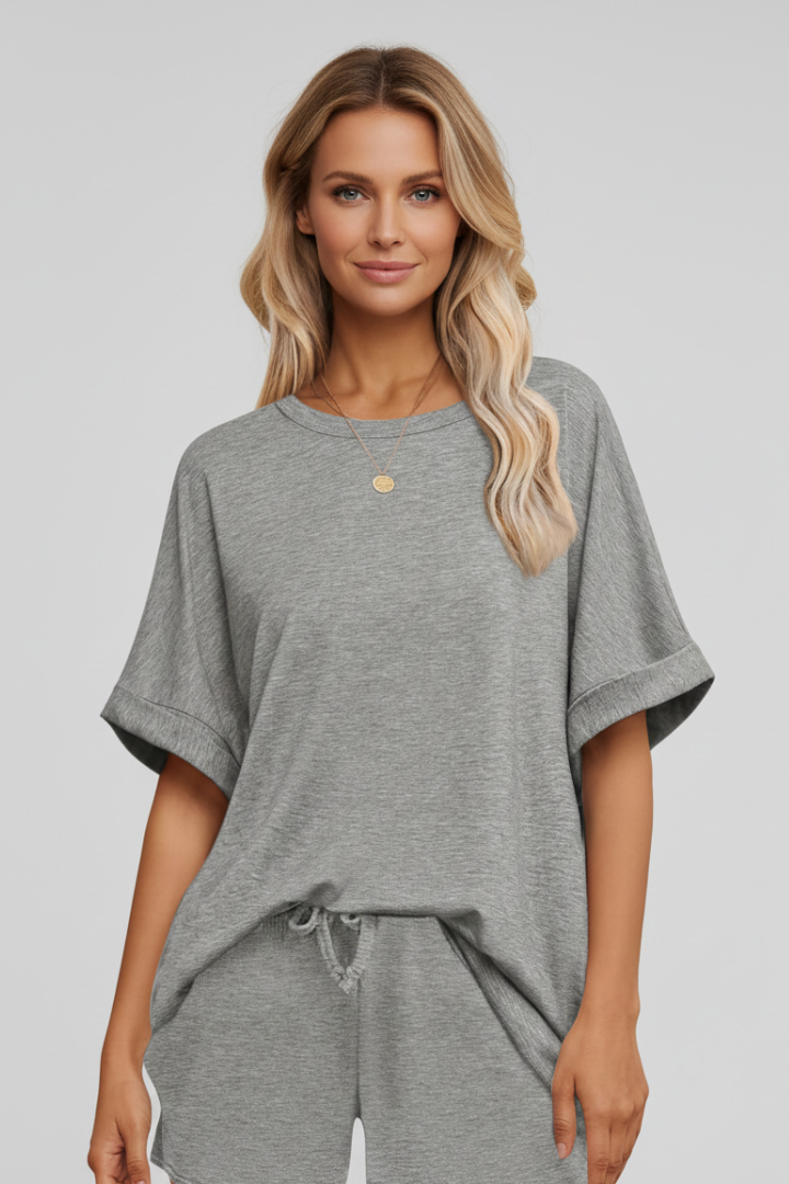 Model wearing batwing top and matching bottoms product image