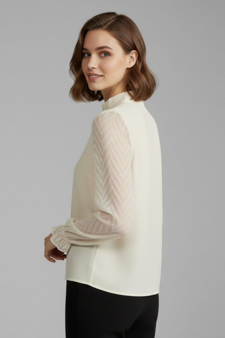 Ivory blouse side angle on gray background