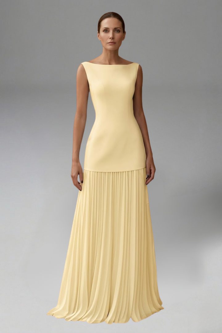 Female model posing casually in layered midi yellow skirt and sleeveless top
