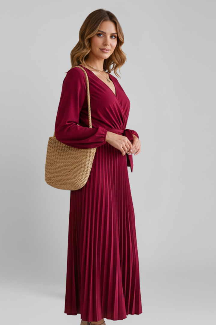 Side angle of pleated maxi dress with model