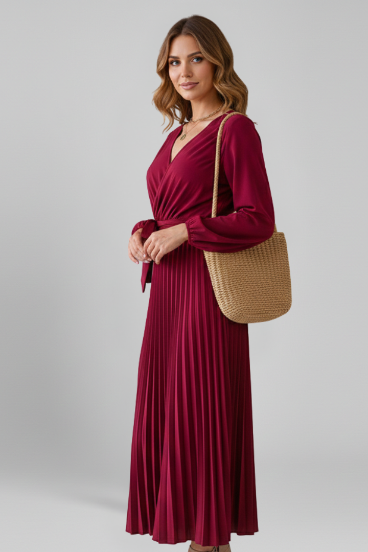 Model showing waist tie red dress, gray background