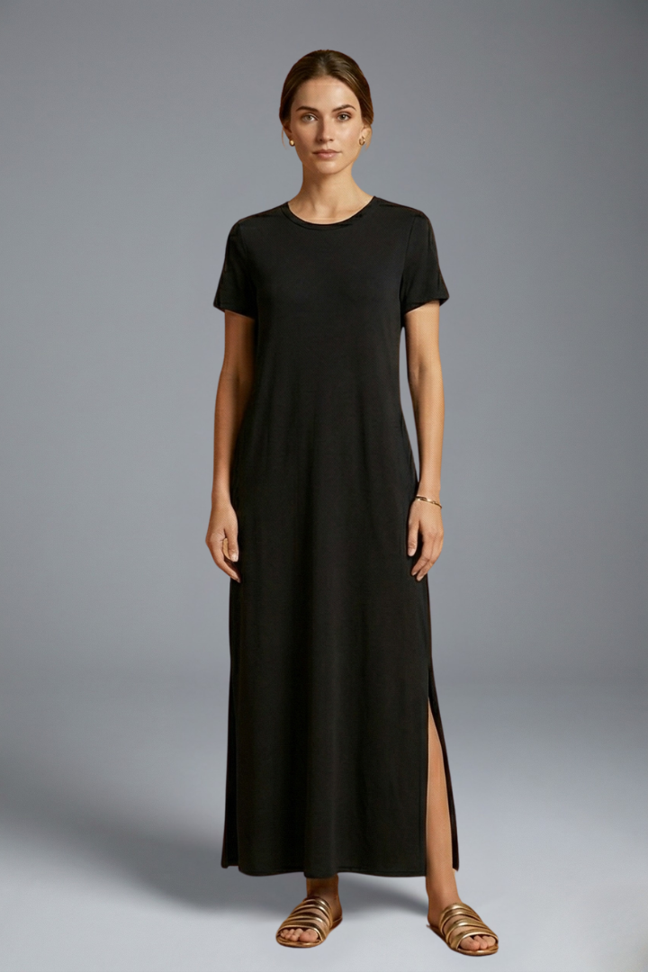 Woman posing in relaxed fit long dress studio