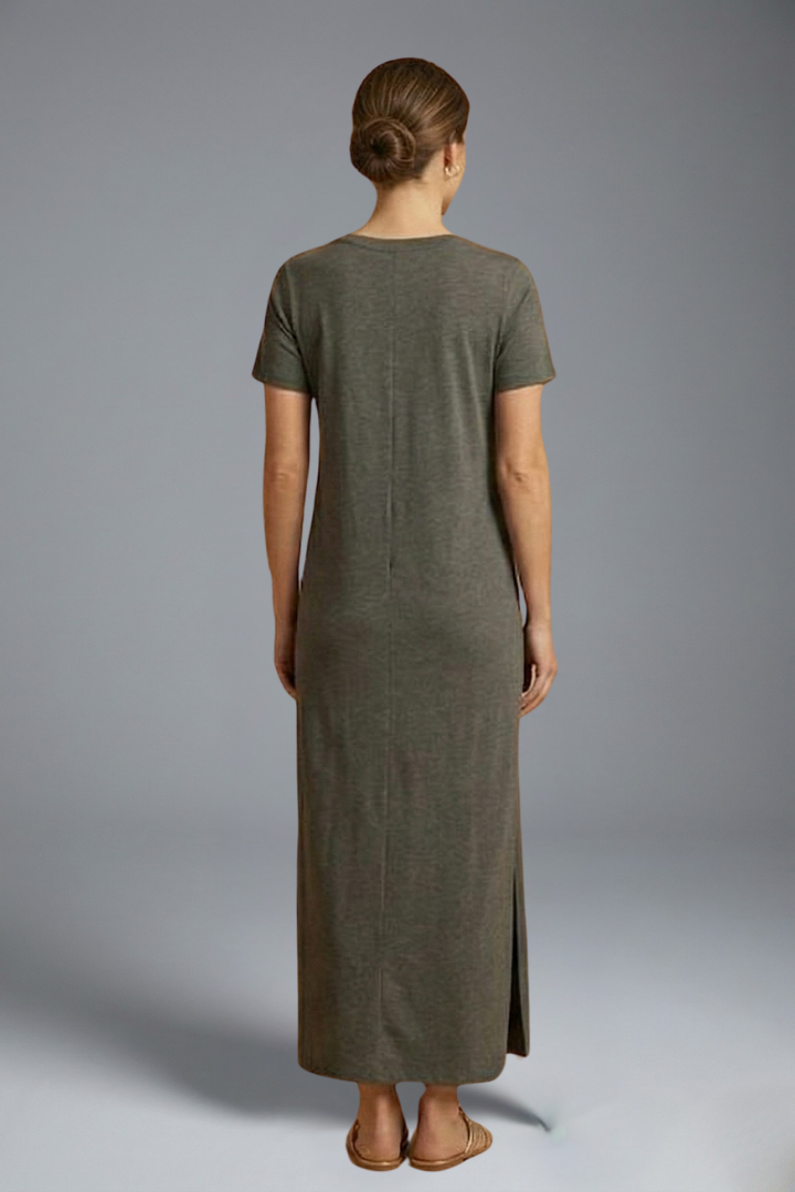 Studio model shot back angle view, woman wearing flowy maxi dress