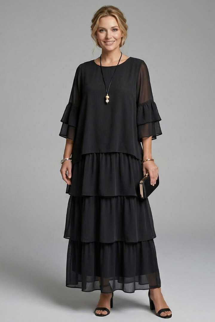 Modest flowing black dress product gray background image
